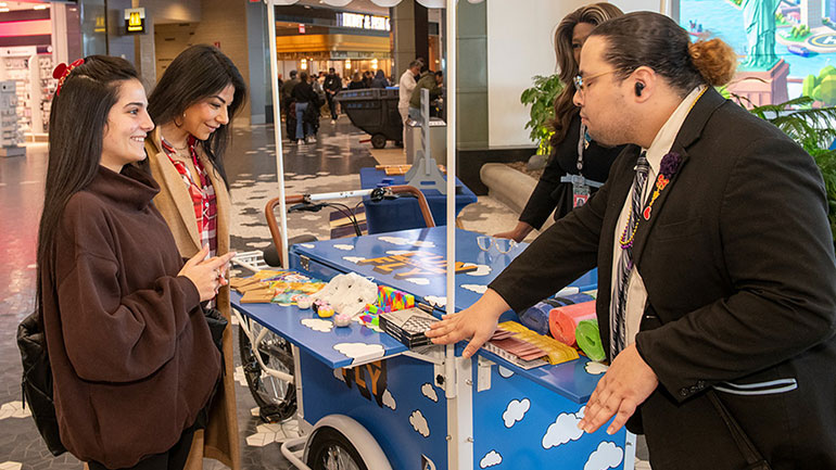 Smiling female travelers experiencing LaGuardia's Terminal B Fun on the Fly